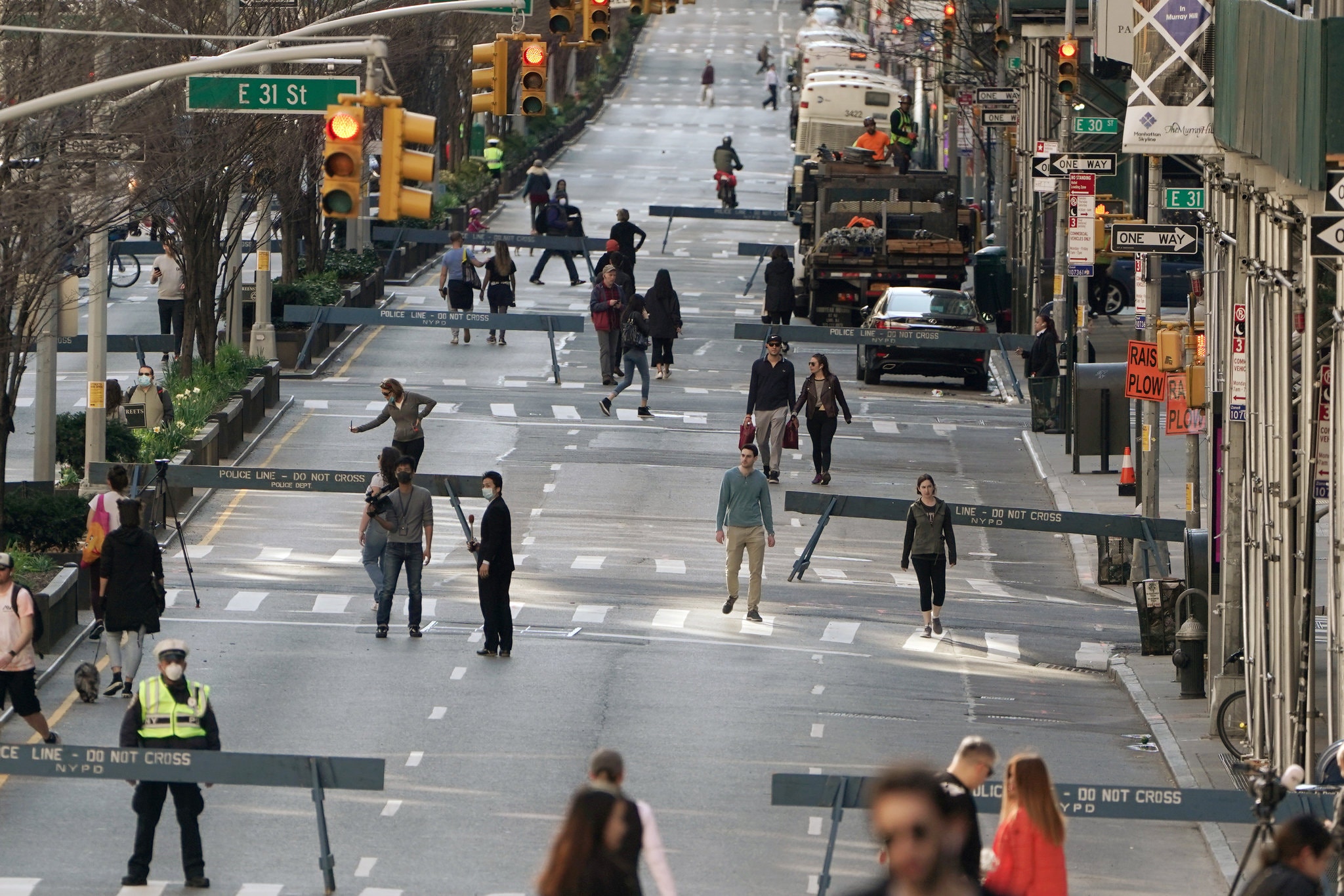 Part of Park Avenue in Manhattan was closed to vehicle traffic on March 27 to give pedestrians more outdoor space — and spacing.Credit...Carlo Allegri/Reuters