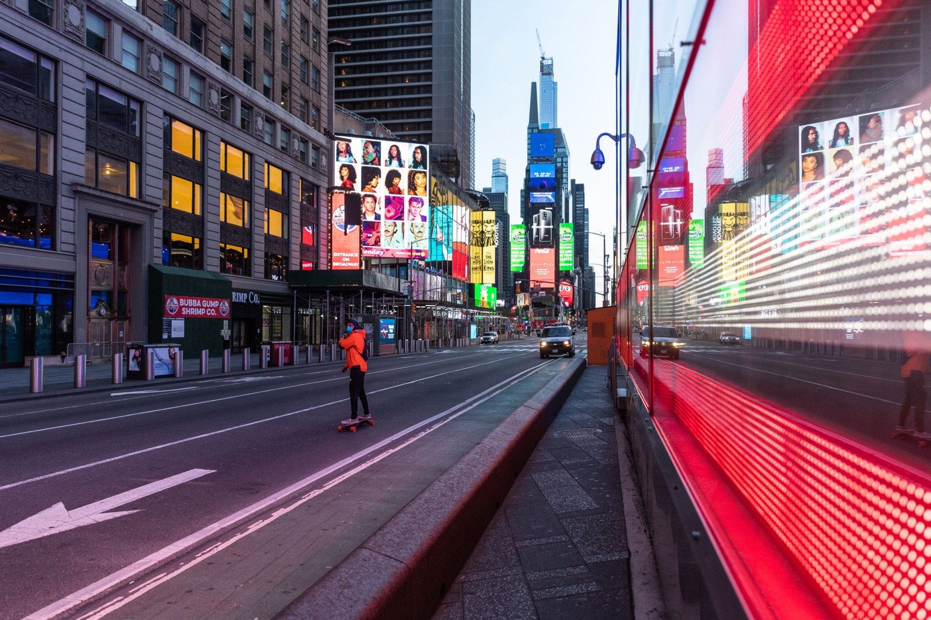 A person wearing a protective mask rides a skateboard in the Times Square neighborhood of New York, U.S., on Wednesday, April 1, 2020. Photographer: Jeenah Moon/Bloomberg