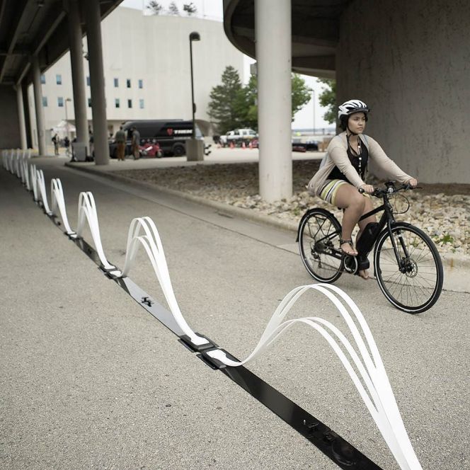 The Saris "Wave" delineator is one of a tiny handful of road barriers that both provide meaningful protection to the vulnerable *and* aren't hideous to look at. A new contest hopes to find more options — and make them cheap, sustainable and durable enough that cities have no excuse not to deploy them. Image source: Creative Commons. 